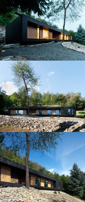 匈牙利木制度假屋-坐落在锯齿状表面岩石的木质屋，几何黑框包围整个房子