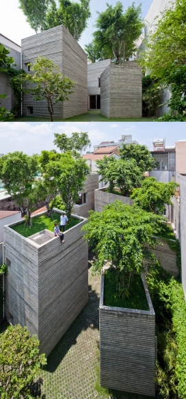 https://www.2008php.com/绿色树屋-坐落在越南胡志明市，树木生长在五个混凝土盒中，像大型盆栽植物，里面住着一家三口，为了支持土壤的重量，水和树木，我们建立了一个承重墙结构，这是不是很常见的越南的房子，建筑围绕中央庭院，后面有几扇窗户保持隐私，大玻璃门窗前尽量自然采光和通风
