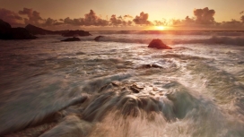 日落海洋岩流