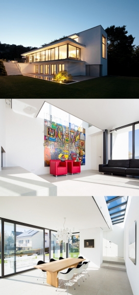 全白色带游泳池的三层别墅建筑-位于德国阿尔卑斯山附近，生活空间中有充足的光线，有间图书馆，是个不错的度假休闲胜地