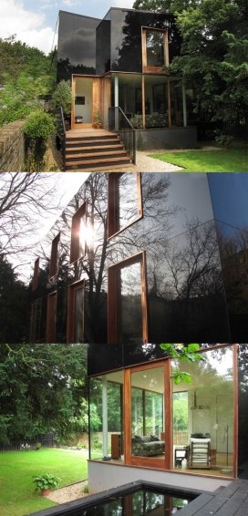 黑屋-大部分的黑色玻璃装饰，外墙看上去像一个黑暗一面镜子，反映了周围环境，是一个不错的度假休闲别墅