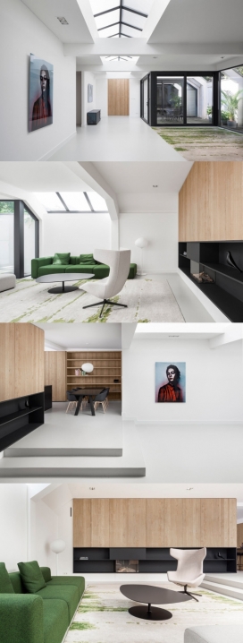 阿姆斯特丹现代明亮的家-曾经是一个车库，现在通过建筑师改造成住宅空间，主楼层房子面积达230平方米，有开放式的客厅天窗，简洁明亮的白色的墙壁和天花板，浅灰色地板，粗糙的橡木和黑面，手工编织地毯，完全是一座豪宅建筑