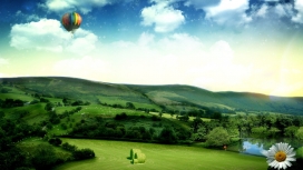 绿色丘陵上的热气球