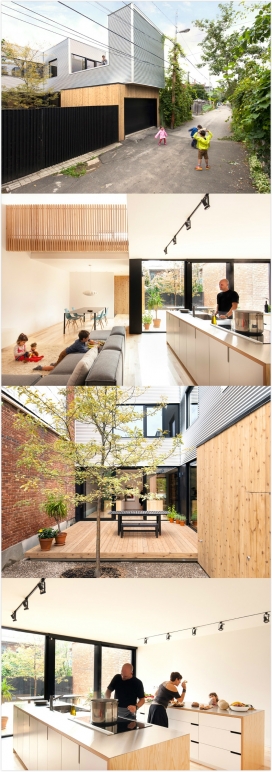 蒙特利尔金属波纹的家-充满活力的楼梯，拉拱棚架构，明亮橙红色的楼梯在屋顶露台两侧，是一座两层高的家庭和车库空间。房子已经经历了几次变革和碎裂，在设计师的设计下，房屋焕然一新，暗红色的砖墙，波纹钢护板，是不是特想也拥有一间