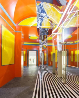 法国的极简主义概念艺术家丹尼尔・布伦惊艳作品-大胆的色彩条纹博物馆建筑，墙壁漆成橙色和黄色占主导地位，8.7厘米厚的黑白色条纹，涵盖了地板的一部分，这意味着一个不同寻常的逃生路线。